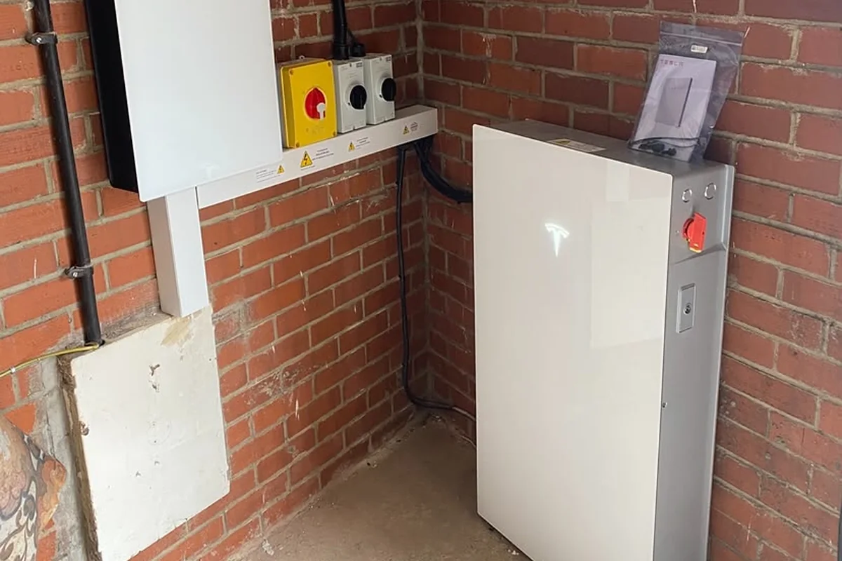 Tesla Powerwall and Backup Gateway in a garage
