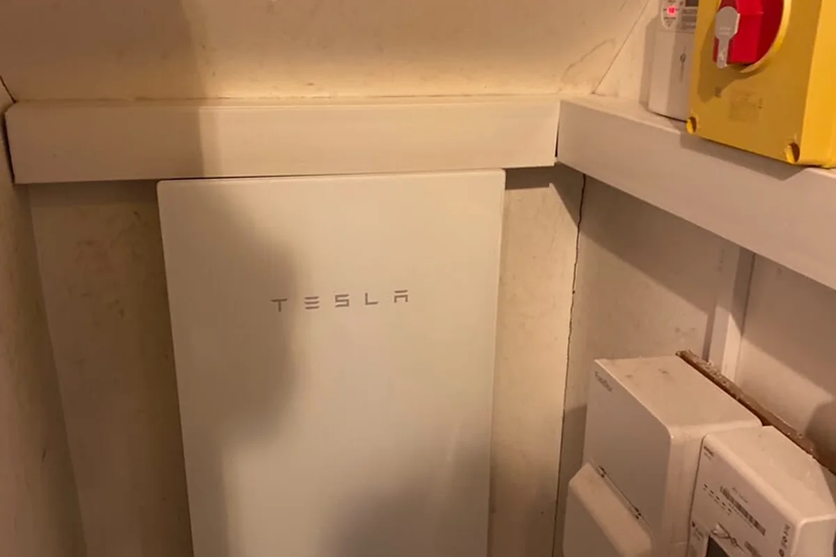 Tesla Powerwall providing whole-home backup, fitted under the stairs