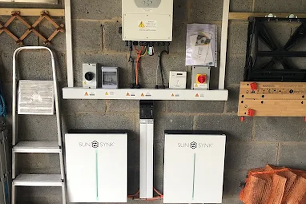 SunSynk hybrid inverter with two battery modules in a garage