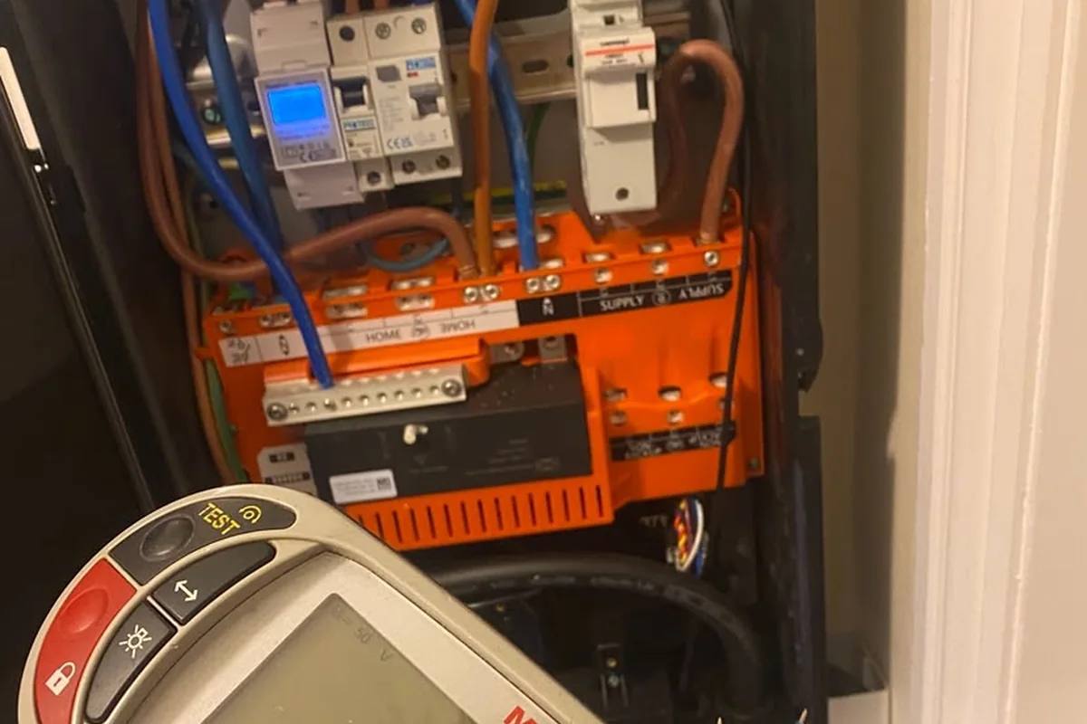 Megger tester at an open consumer unit during inspection