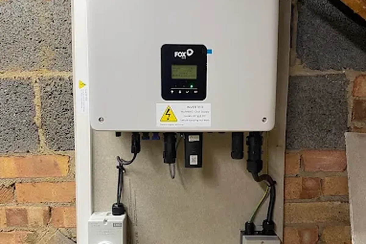 Fox ESS hybrid inverter mounted on a brick wall