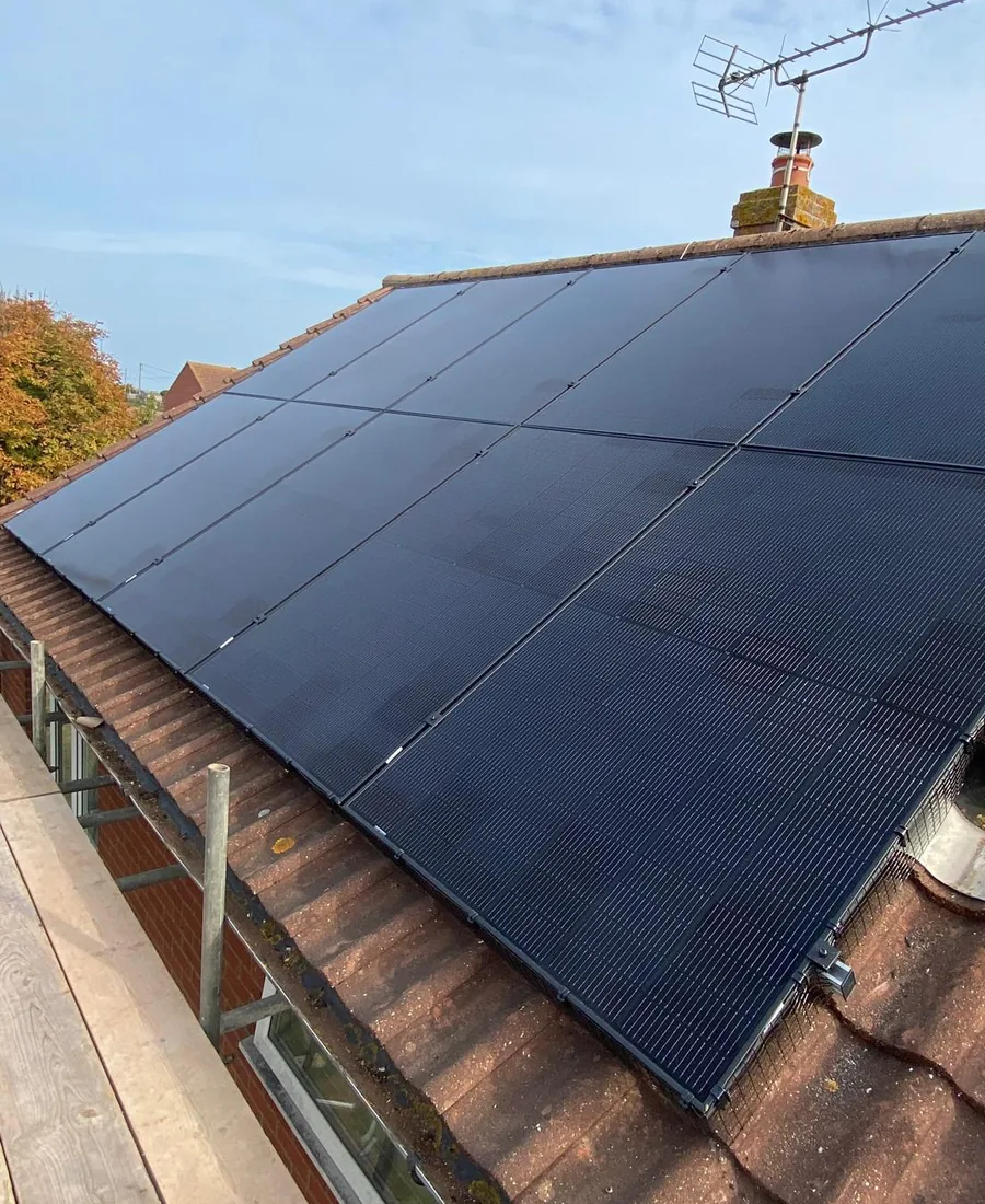 Black solar panels installed on a tiled roof in Norfolk